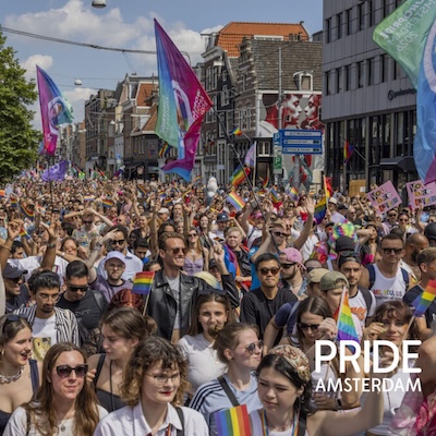 Pride Amsterdam march with crowds and flags